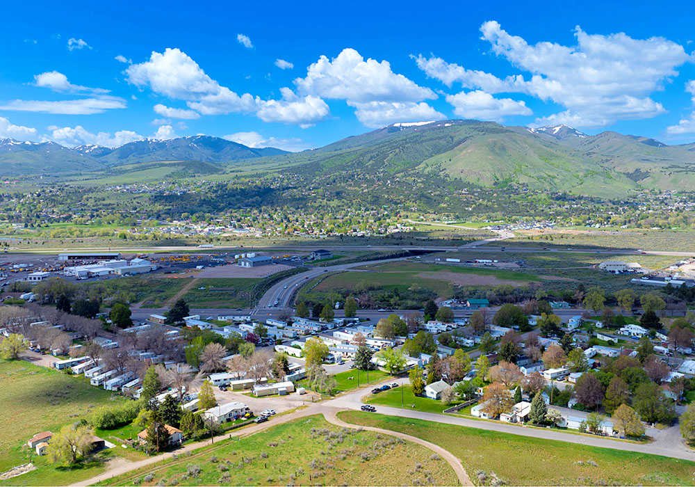 Elk Village Mobile Home Park - drone shot with mountain in background